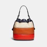 COACH FIELD BUCKET BAG WITH COLORBLOCK QUILTING AND COACH BADGE