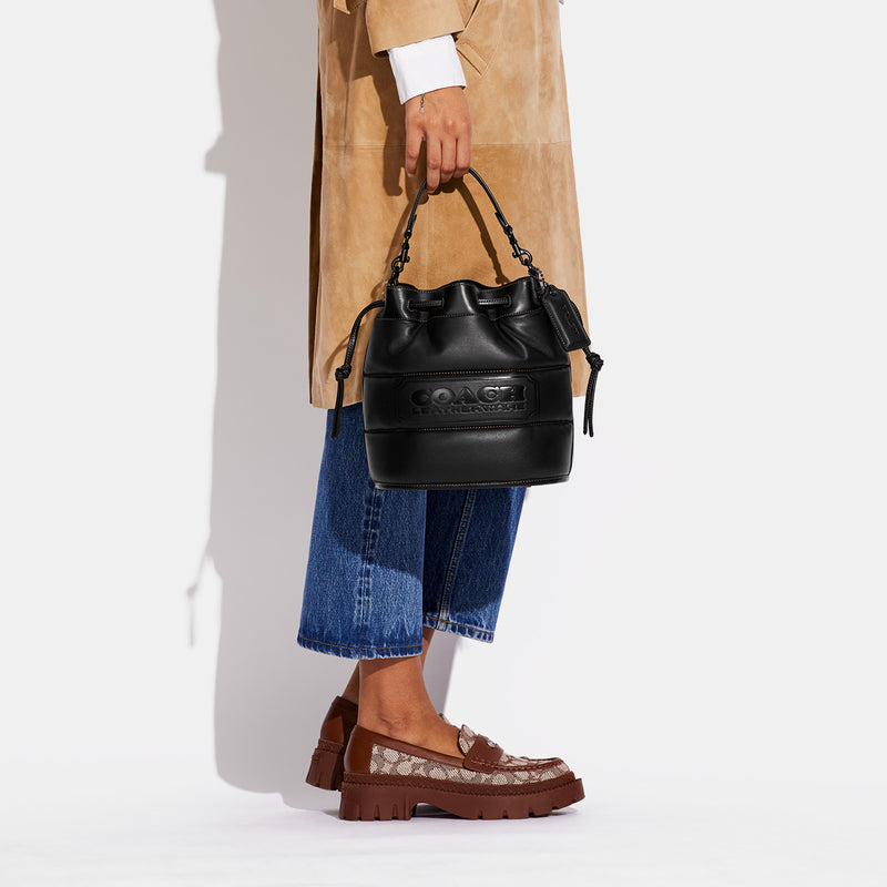 COACH FIELD BUCKET BAG WITH QUILTING AND COACH BADGE